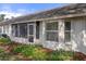 Home exterior with a screened in porch, offering a relaxing outdoor space, and well-maintained lawn at 11008 Torrey Pines Ct, Hudson, FL 34667