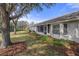 A spacious backyard with a screened-in lanai and well-maintained landscaping at 11008 Torrey Pines Ct, Hudson, FL 34667