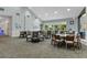 Spacious dining area with ample seating and natural light, creating a warm and inviting atmosphere for residents at 11008 Torrey Pines Ct, Hudson, FL 34667