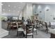 A dining area featuring well-spaced tables and chairs, creating an elegant setting for communal meals at 11008 Torrey Pines Ct, Hudson, FL 34667