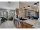 Stylish kitchen boasts stainless steel appliances and a granite countertop island at 11008 Torrey Pines Ct, Hudson, FL 34667