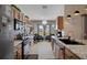 Well-lit kitchen with a large island, modern appliances, and views of the outdoors at 11008 Torrey Pines Ct, Hudson, FL 34667