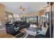 Spacious living room with hardwood floors, ceiling fan, and adjacent dining area at 11008 Torrey Pines Ct, Hudson, FL 34667