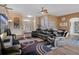 Open living space boasting hardwood floors and a view of the front entrance and kitchen at 11008 Torrey Pines Ct, Hudson, FL 34667