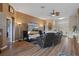 Well-lit living room with hardwood floors and a view of the front entrance at 11008 Torrey Pines Ct, Hudson, FL 34667