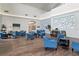 Spacious resident lounge with comfortable seating, offering a welcoming atmosphere for relaxation and socialization at 11008 Torrey Pines Ct, Hudson, FL 34667