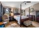 Beautiful main bedroom with a four-poster bed and ample natural light at 11008 Torrey Pines Ct, Hudson, FL 34667