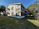 Exterior of condo building with screened balcony and green lawn at 12408 Eagleswood Dr # B, Hudson, FL 34667