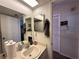 Bathroom featuring a vanity, large mirror and a view to the shower/toilet at 12408 Eagleswood Dr # B, Hudson, FL 34667