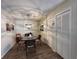 Dining area features wood flooring, decorative lighting fixture and closet doors at 12408 Eagleswood Dr # B, Hudson, FL 34667