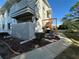 Exterior view of condo building with balcony, walkway and landscaping at 12408 Eagleswood Dr # B, Hudson, FL 34667