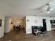 Open-concept living space featuring wood-look floors, a ceiling fan, and a view of the dining area at 12408 Eagleswood Dr # B, Hudson, FL 34667