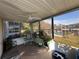 Enclosed patio featuring a ceiling fan and view of the yard at 12408 Eagleswood Dr # B, Hudson, FL 34667