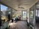 Cozy sunroom filled with natural light, featuring neutral carpeting and sliding glass doors to the outside area at 12408 Eagleswood Dr # B, Hudson, FL 34667