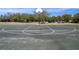 A community basketball court offers an outdoor recreational space to play basketball for fitness and friendly competition at 13357 Marble Sands Ct, Hudson, FL 34669