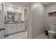 Bathroom featuring a double vanity, neutral tile, and modern fixtures at 13357 Marble Sands Ct, Hudson, FL 34669