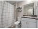 Cozy bathroom featuring a shower, toilet, vanity, and modern finishes at 13357 Marble Sands Ct, Hudson, FL 34669