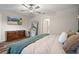 Bright bedroom with wood floors, modern furniture, and soft, natural light at 13357 Marble Sands Ct, Hudson, FL 34669
