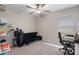 Bedroom with neutral walls, carpet, ceiling fan and a large window at 13357 Marble Sands Ct, Hudson, FL 34669