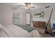 Inviting bedroom with wood floors, ceiling fan, and natural light at 13357 Marble Sands Ct, Hudson, FL 34669