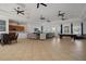 This clubhouse features neutral decor, ceiling fans, a kitchenette, a pool table, and comfortable seating at 13357 Marble Sands Ct, Hudson, FL 34669