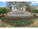 Inviting Lakeside community entrance sign surrounded by manicured landscaping at 13357 Marble Sands Ct, Hudson, FL 34669