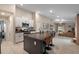 Spacious kitchen showcasing a large island with seating, granite countertops, and stainless steel appliances at 13357 Marble Sands Ct, Hudson, FL 34669