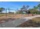 Community playground with swings, slide, and covered picnic tables for Gathering fun in a secure outdoor environment at 13357 Marble Sands Ct, Hudson, FL 34669