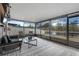 Inviting screened porch with comfortable seating and a scenic backyard lake view at 13357 Marble Sands Ct, Hudson, FL 34669