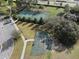 Tennis and basketball courts offer recreational opportunities amidst green spaces at 13357 Marble Sands Ct, Hudson, FL 34669