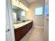 Bathroom features double sinks with granite countertops and plenty of counter space at 1421 Apollo Beach Blvd, Apollo Beach, FL 33572