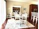 Open dining room features wood floors, a large table and seating for six at 1421 Apollo Beach Blvd, Apollo Beach, FL 33572