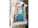 Aerial view of a kidney-shaped pool and patio area with ample seating at 1421 Apollo Beach Blvd, Apollo Beach, FL 33572