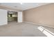 Bedroom with neutral carpet, large closet and views to another room through open doorway at 1442 Lenton Rose Ct, Trinity, FL 34655