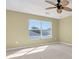 Bright bedroom features a ceiling fan and double windows providing lots of natural light at 1442 Lenton Rose Ct, Trinity, FL 34655