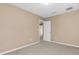 Neutral bedroom with carpet and an open door at 1442 Lenton Rose Ct, Trinity, FL 34655