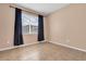 Cozy bedroom with tile flooring, a large window, and neutral walls at 1442 Lenton Rose Ct, Trinity, FL 34655