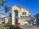 Charming two-story home features an attached two-car garage and manicured lawn at 1442 Lenton Rose Ct, Trinity, FL 34655