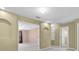 Spacious hallway with archways, carpet, and neutral walls leading to bedrooms at 1442 Lenton Rose Ct, Trinity, FL 34655