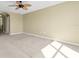 Spacious living room with neutral carpet and a ceiling fan at 1442 Lenton Rose Ct, Trinity, FL 34655