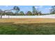 A generous backyard enclosed by a pristine white fence offers space for recreation and relaxation at 14421 Nonna Sky Drive Dr, Spring Hill, FL 34609