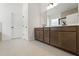 Bathroom with double sink vanity with tile floors and modern fixtures at 14421 Nonna Sky Drive Dr, Spring Hill, FL 34609