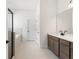 Spacious bathroom with a stand-up shower and soaking tub with modern double vanity at 14421 Nonna Sky Drive Dr, Spring Hill, FL 34609
