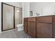 Bathroom with a walk-in shower, toilet and a dark wood vanity at 14421 Nonna Sky Drive Dr, Spring Hill, FL 34609
