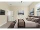 Modern bedroom with an en-suite bathroom and a soothing color palette at 14421 Nonna Sky Drive Dr, Spring Hill, FL 34609