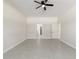 Large bedroom featuring tile floors, neutral paint and a ceiling fan with a light at 14421 Nonna Sky Drive Dr, Spring Hill, FL 34609