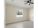 Bedroom with ceiling fan and large windows offering plenty of natural light at 14421 Nonna Sky Drive Dr, Spring Hill, FL 34609