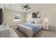 Beautiful bedroom with a queen-size bed, ceiling fan, and lots of natural light at 14421 Nonna Sky Drive Dr, Spring Hill, FL 34609