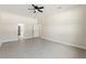 Large bedroom featuring tile floors, neutral paint and a ceiling fan with a light at 14421 Nonna Sky Drive Dr, Spring Hill, FL 34609