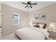 Inviting bedroom with neutral tones, plush bedding, and ample natural light for a serene atmosphere at 14421 Nonna Sky Drive Dr, Spring Hill, FL 34609